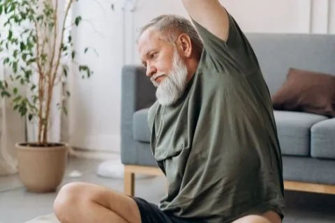 Person engaging in seated yoga