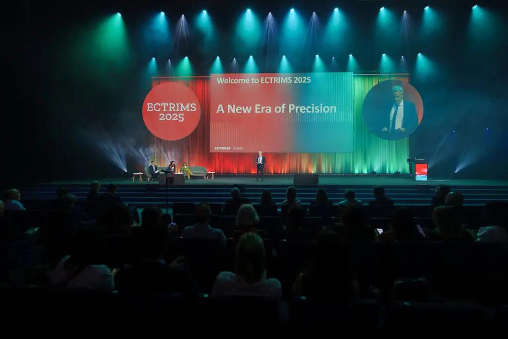 ECTRIMS president, Dr. Bruno Stankoff, on stage delivering the opening address.