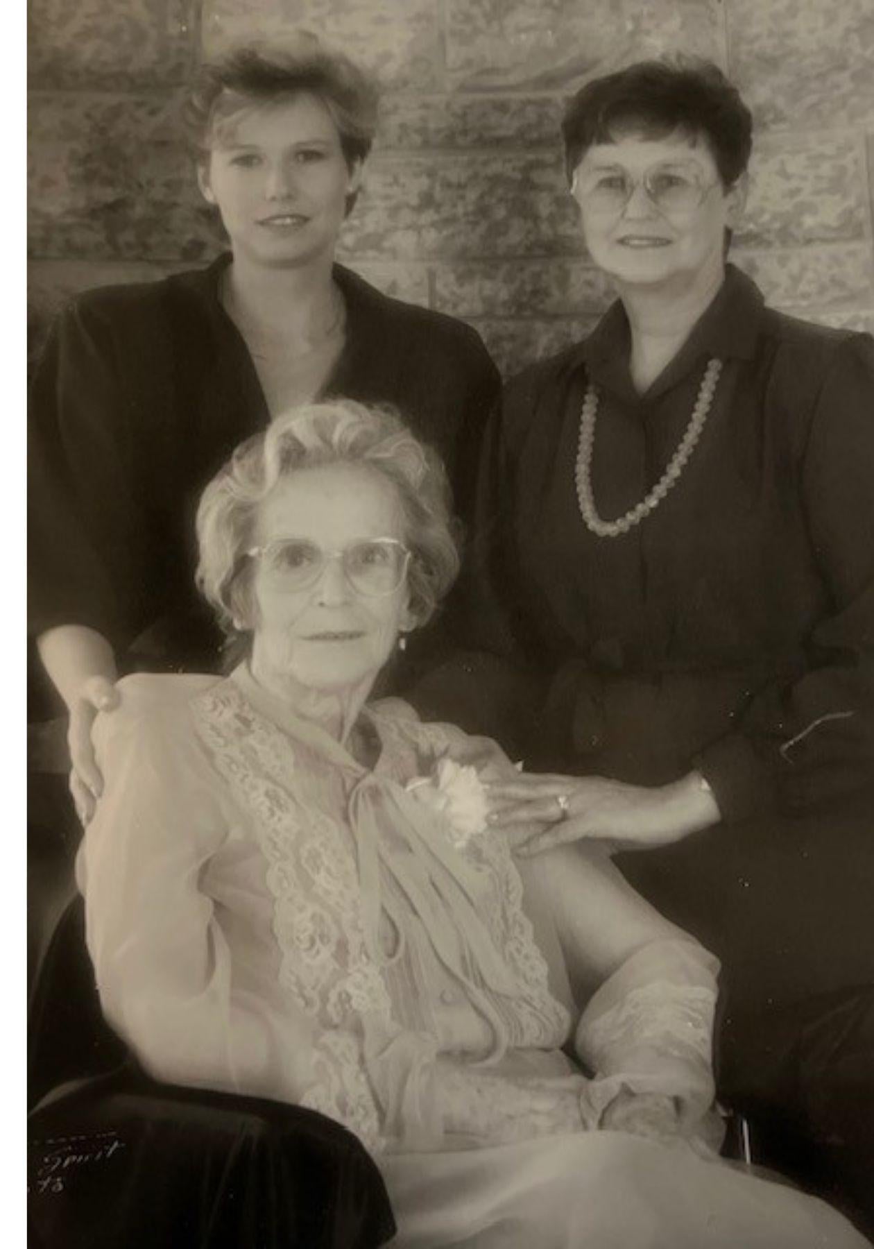 Black and white photo of a younger Diana, her mom, and nanny