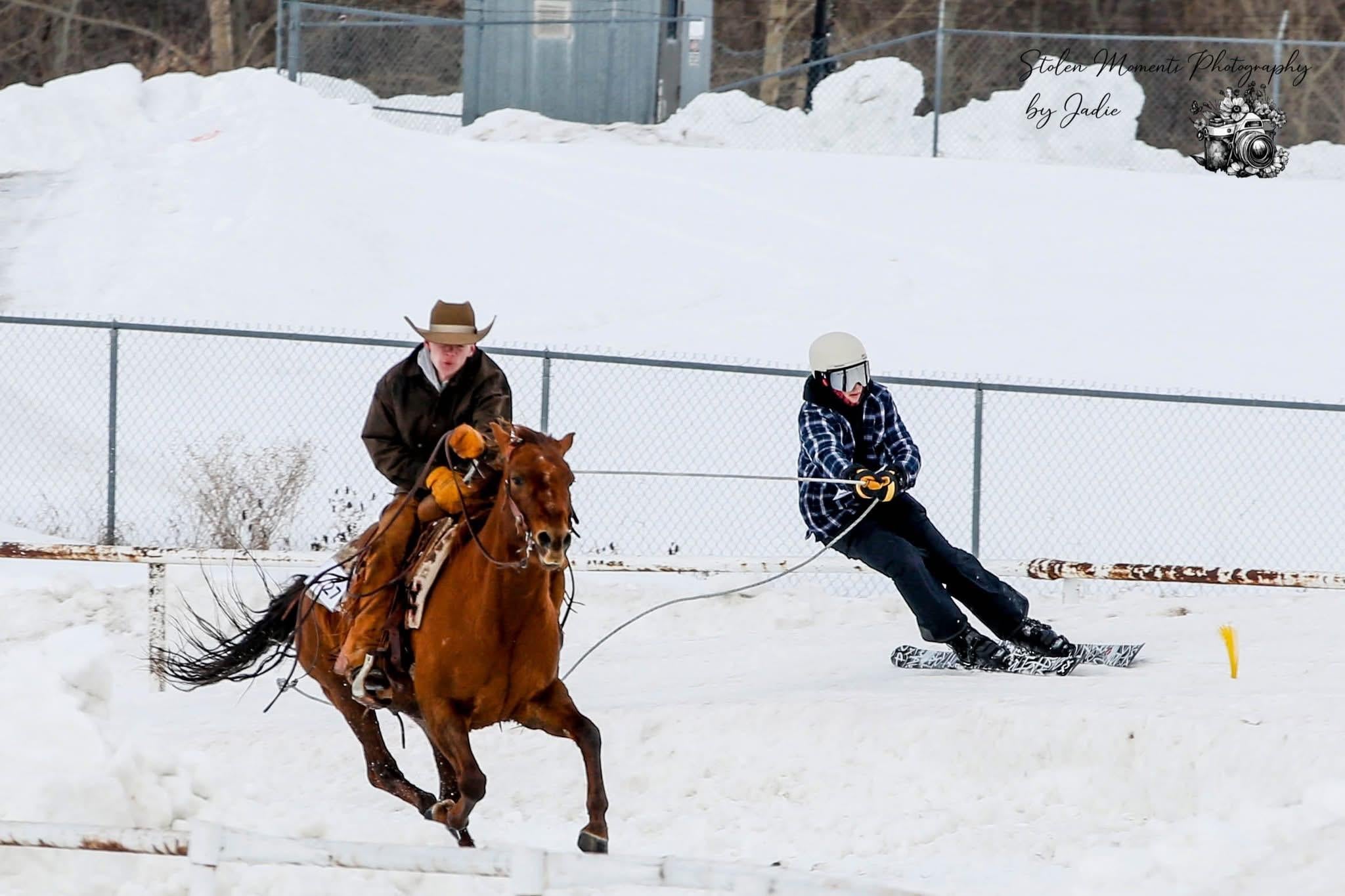 James, riding a horse in the snow, participating in his Skijoring for MS event.